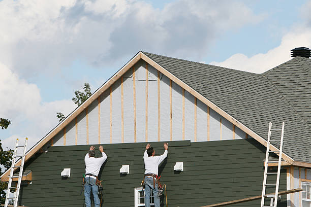 Professional Storm Damage Siding Repair technician working in Balsam Grove, NC